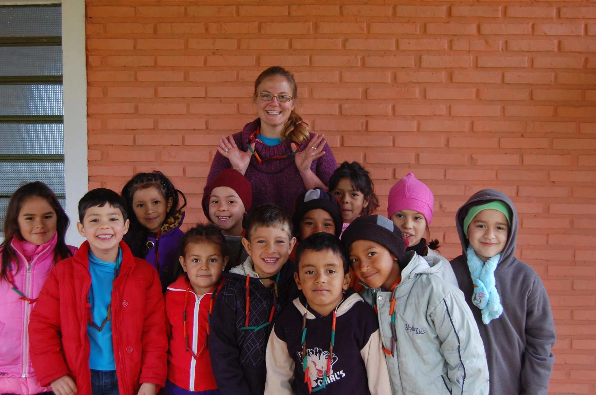 Stephanie and her group of young artists proudly display their creations from art camp