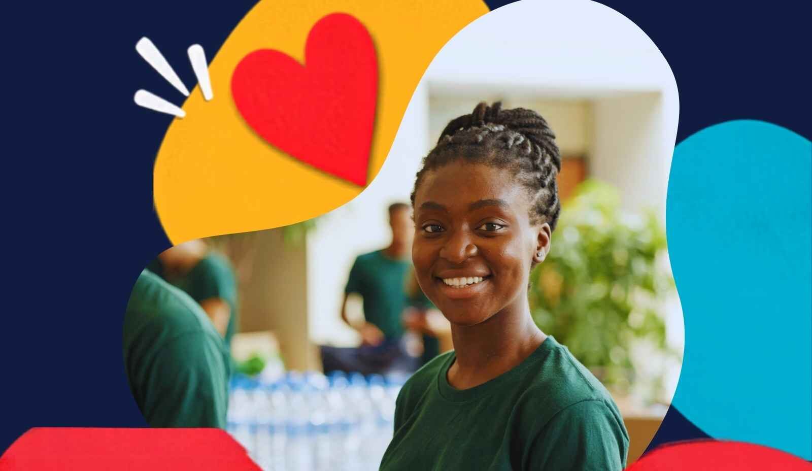 Young woman volunteering with water bottles behind and others in similar green shirts in teh background.